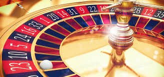 Adults reviewing 555w Slots information with responsible gaming awareness